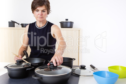 Woman in the kitchen at the stove