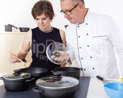 Woman with Chef Cook in the kitchen