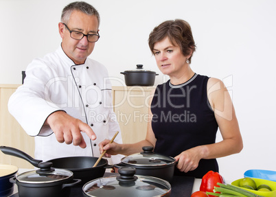 Woman with Chef Cook in the kitchen