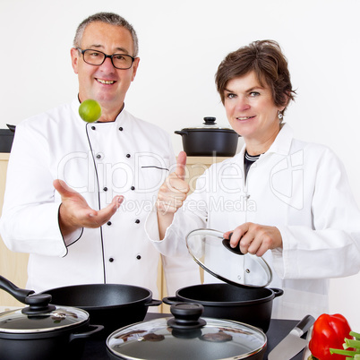 Woman with Chef Cook in the kitchen