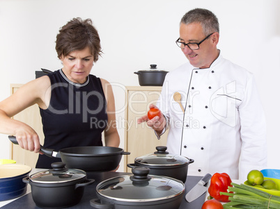 Woman with Chef Cook in the kitchen