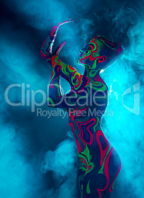 Nightclub dancer posing nude with glowing body art