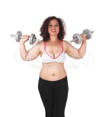 Woman lifting dumbbells.