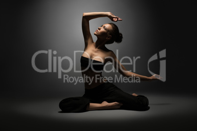Studio photo of beautiful sexy girl doing yoga