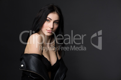 Beautiful brunnette model woman posing in studio