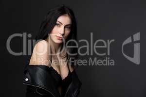 Beautiful brunnette model woman posing in studio