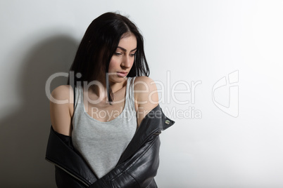 Beautiful brunnette model woman posing in studio