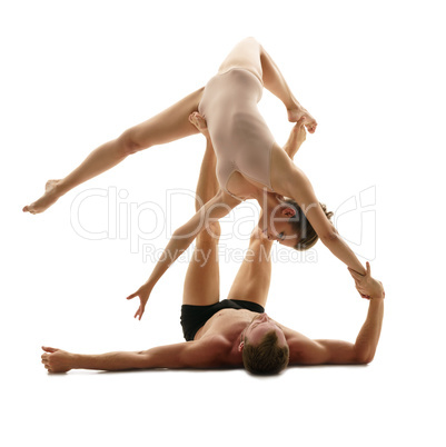 Paired gymnastics. Man and girl perform support
