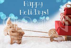 Reindeer, Sled, Light Blue Background, Text Happy Holidays