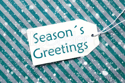 Label On Turquoise Paper, Snowflakes, Text Seasons Greetings