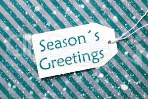 Label On Turquoise Paper, Snowflakes, Text Seasons Greetings