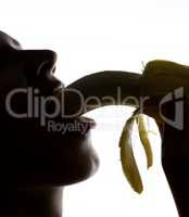 Close-up of Young amazed woman holding banana, she is going to eat a banana. she sucks a banana