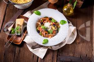 Ribbon Pasta with zucchini and olives in tomato sauce