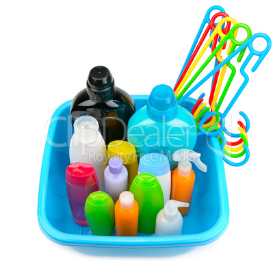 plastic basin with a set of household chemicals isolated on whit