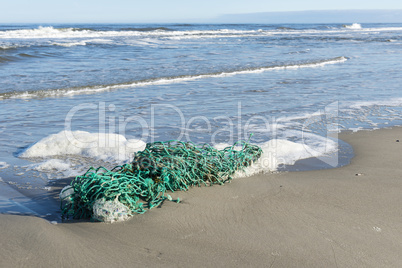 Green fishing net on the beach.