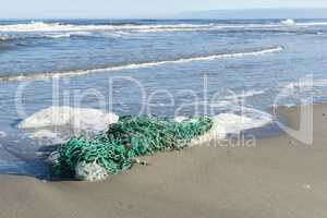 Green fishing net on the beach.