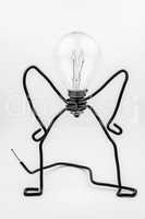Fantasy figure of a light bulb and wire.
