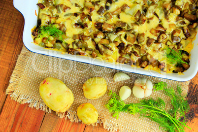 Baked potato with slices of eggplant cheese and garlic