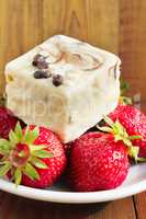 strawberries and sweet cake on the white plate