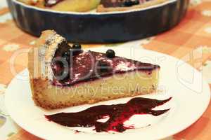 Piece of pie with bilberry on the plat