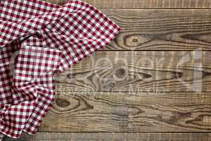 Empty wooden table with tablecloth