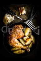 roasted chicken leg with potatoes