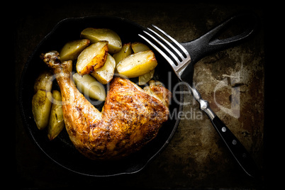 roasted chicken leg with potatoes