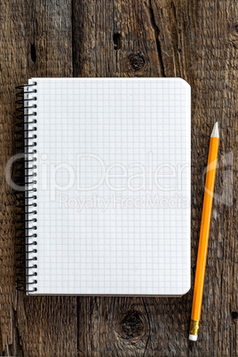 notepad on wooden table