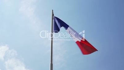 Textile flag of France on a flagpole