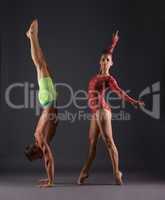 Studio photo of sports gymnasts posing at camera