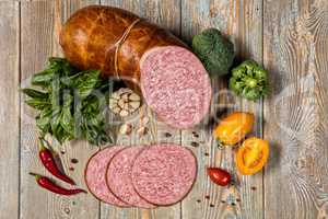 Sausage And Vegetables On An Old Wooden Desk