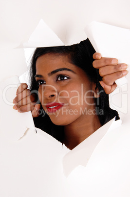 Woman looking through a paper howl.
