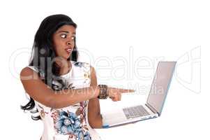 Woman is shocked from laptop screen.