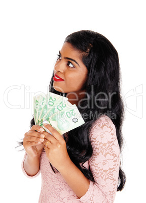 Young Indian woman holding money.