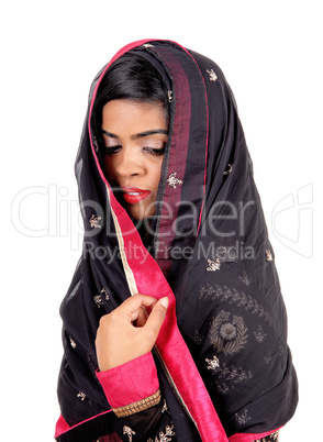 Woman covered in a veil.