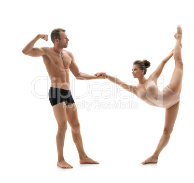 Acrobatics. Strong man in pair with graceful girl