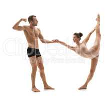 Acrobatics. Strong man in pair with graceful girl