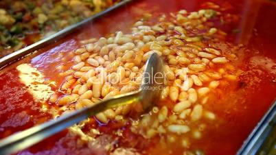 Turkish rice and beans preparing in traditional restaurant, montaged