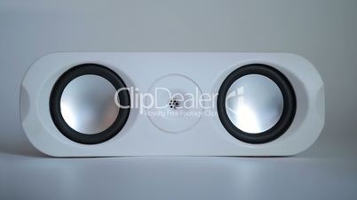 Closeup of set of round audio speakers isolated