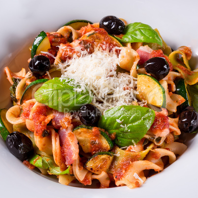 Ribbon Pasta with zucchini and olives in tomato sauce