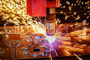 CNC Laser plasma cutting of metal, modern industrial technology.