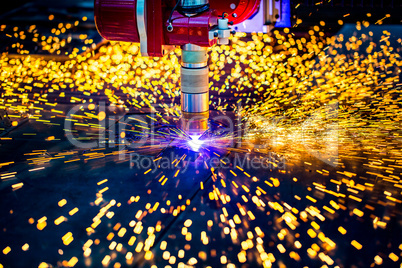 CNC Laser plasma cutting of metal, modern industrial technology.