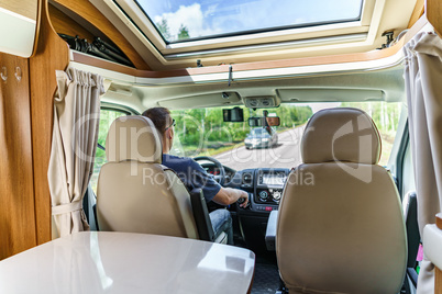 Man driving on a road in the Camper Van