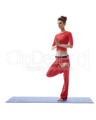 Yoga instructor posing while standing on one leg