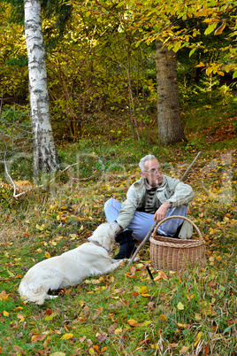 Old man and dog mushrooming