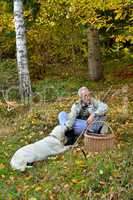 Old man and dog mushrooming