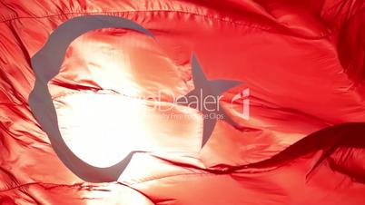 Turkish flag slow motion waving with sunny background