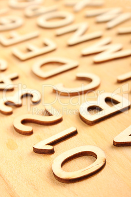 Wooden alphabet. Include numerals.