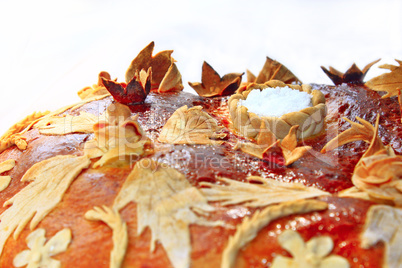 round loaf with floral patern and salt