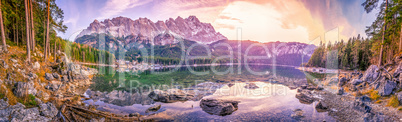 Alps mountains reflected in a lake at sunset